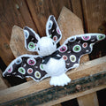 Peluche chauve souris oeil d'halloween blanche